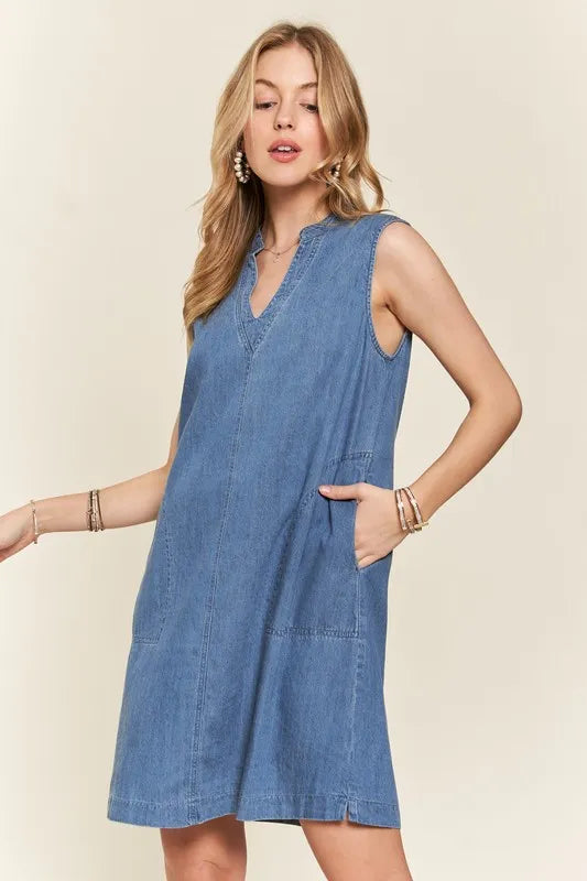 ADORA notched sleeveless denim dress in medium blue wash with pockets