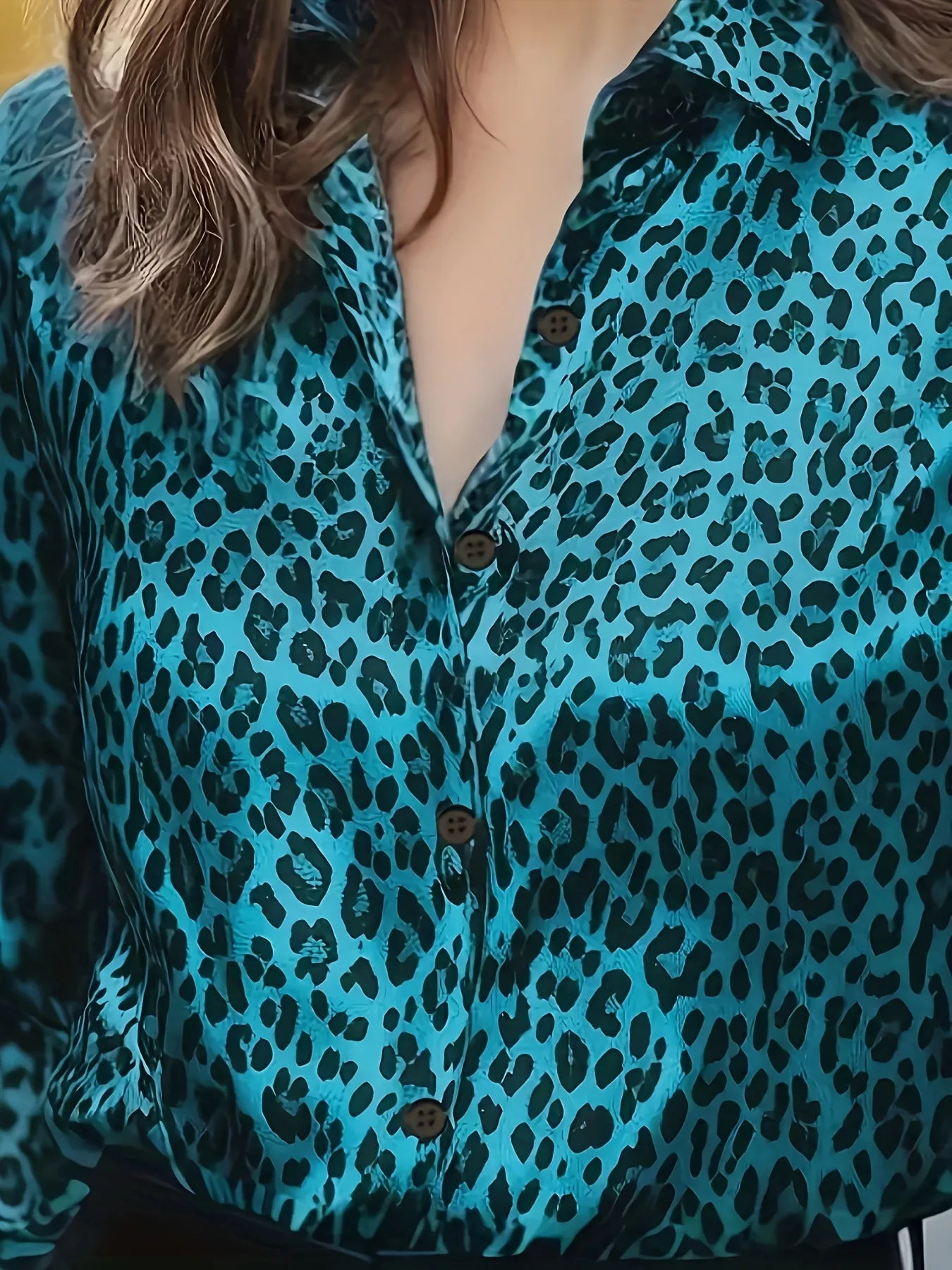 Teal leopard-print button-up long sleeve blouse with dark brown buttons