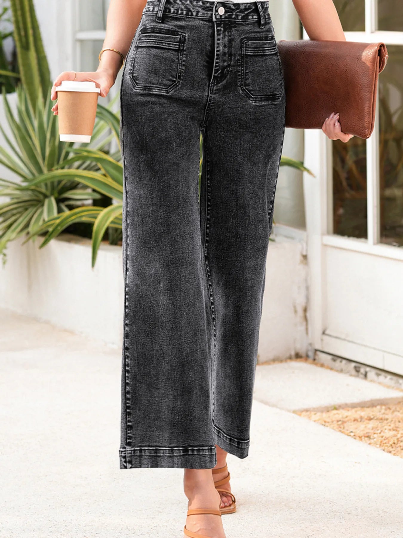 High-waisted wide-leg washed jeans in dark gray with faded wash and rolled cuffs