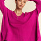 Vibrant fuchsia Davi & Dani ribbed V-neck sweater with oversized fit and asymmetrical hem