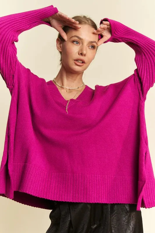 Vibrant fuchsia Davi & Dani ribbed V-neck sweater with oversized fit and asymmetrical hem