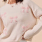 SO ME cream knit sweater with pink embroidered bows