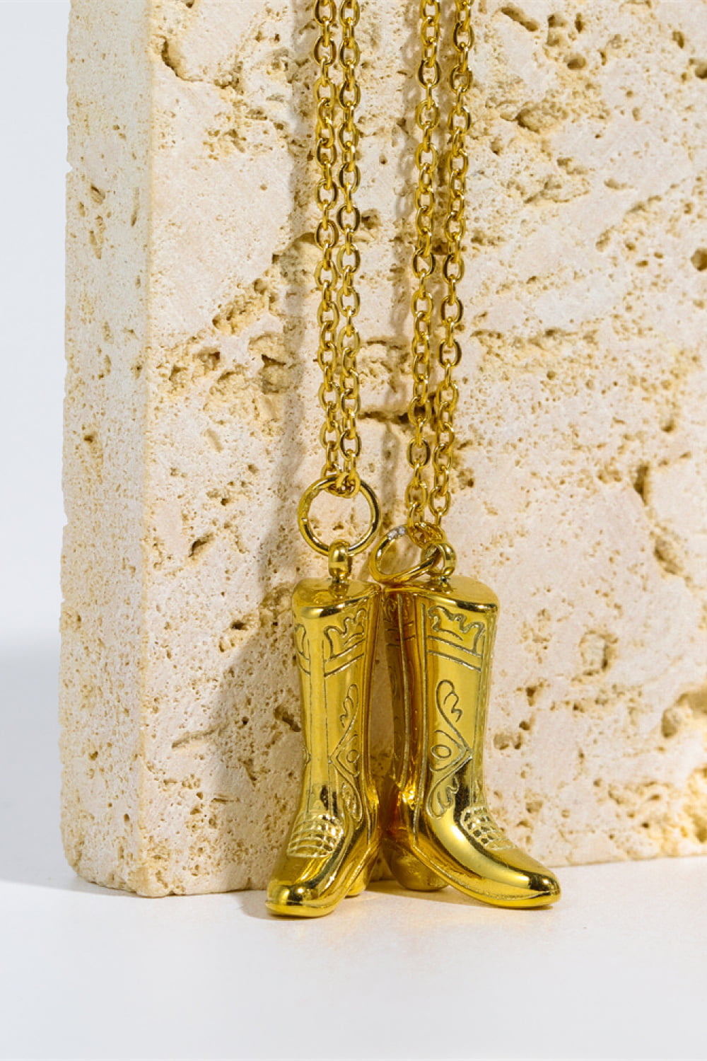 Golden cowboy boot pendant necklace with engraved stainless steel design