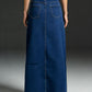 Raw hem maxi denim skirt back view with deep blue denim, straight cut, pockets, frayed hem