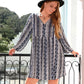 Plus size boho print V-neck long sleeve mini dress in navy white floral pattern