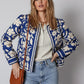 Blue floral bomber jacket with white cream accents open front cuffs