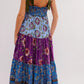 Floral tiered maxi dress with blue purple floral pattern and green straps