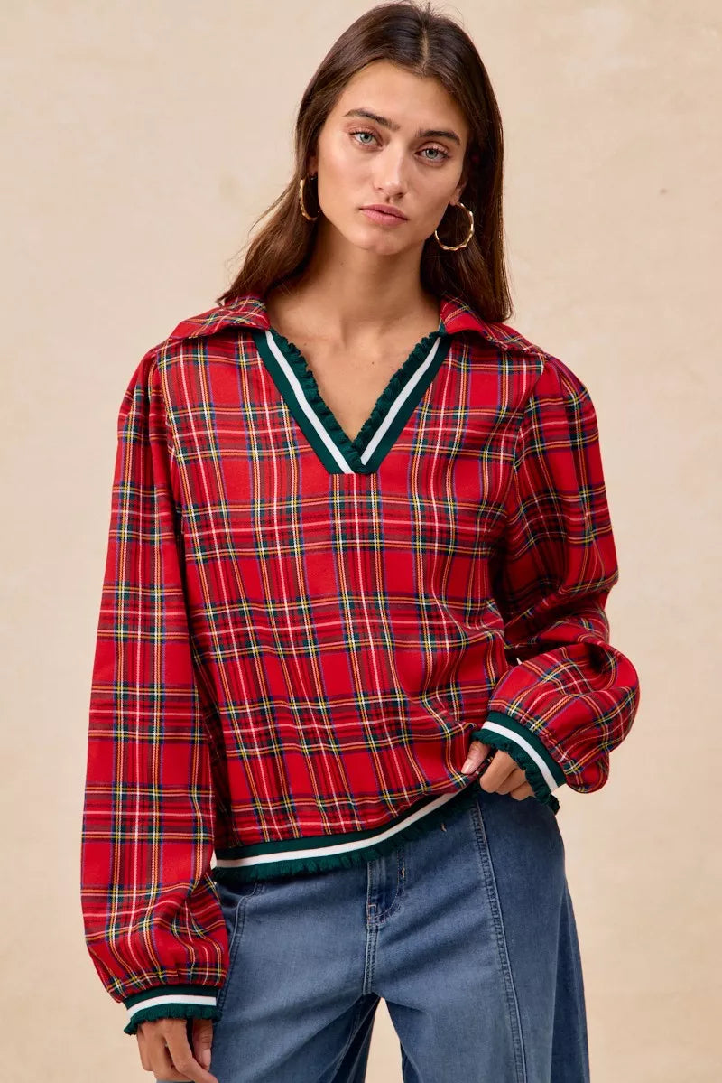 Red plaid collared hoodie with green white trim and ruffles