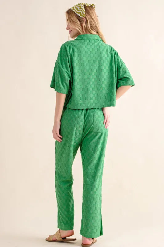 Green quilted pajama set with bandana headband, sandals, and brushed checkerboard pants