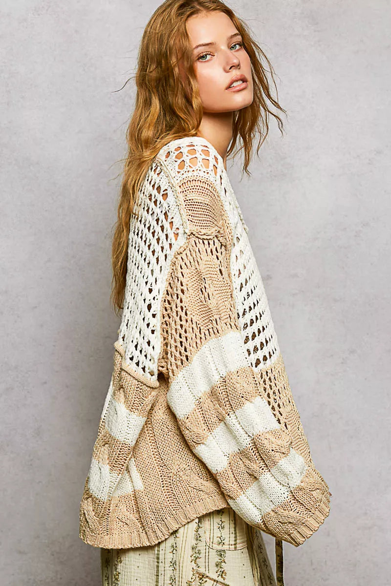 Beige and white chunky knit top with crochet openwork and color-blocked stripes