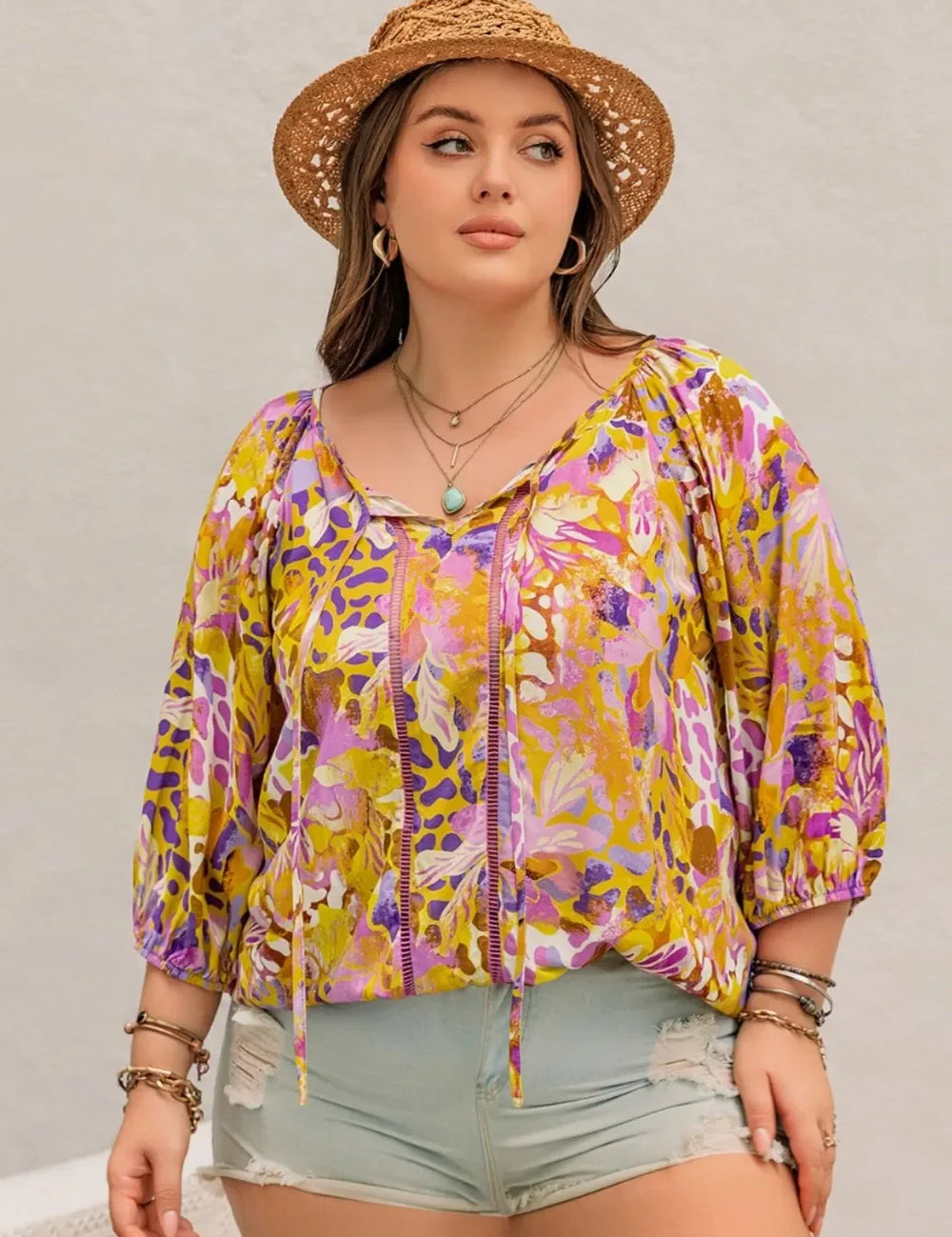Plus size printed tie neck blouse in yellow purple floral with lace sleeves