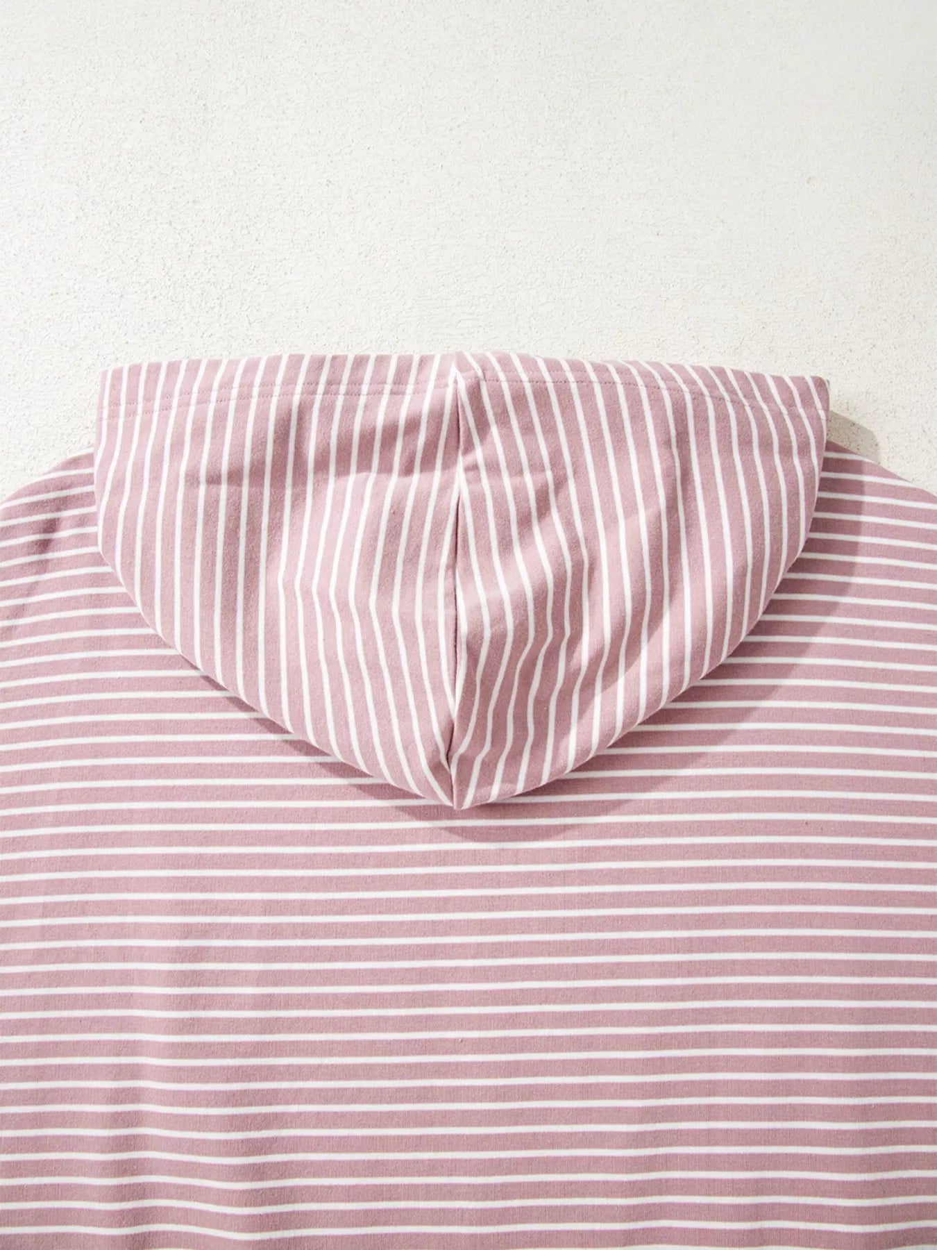 Dusty pink striped thumbhole hoodie with side slits and drop shoulders