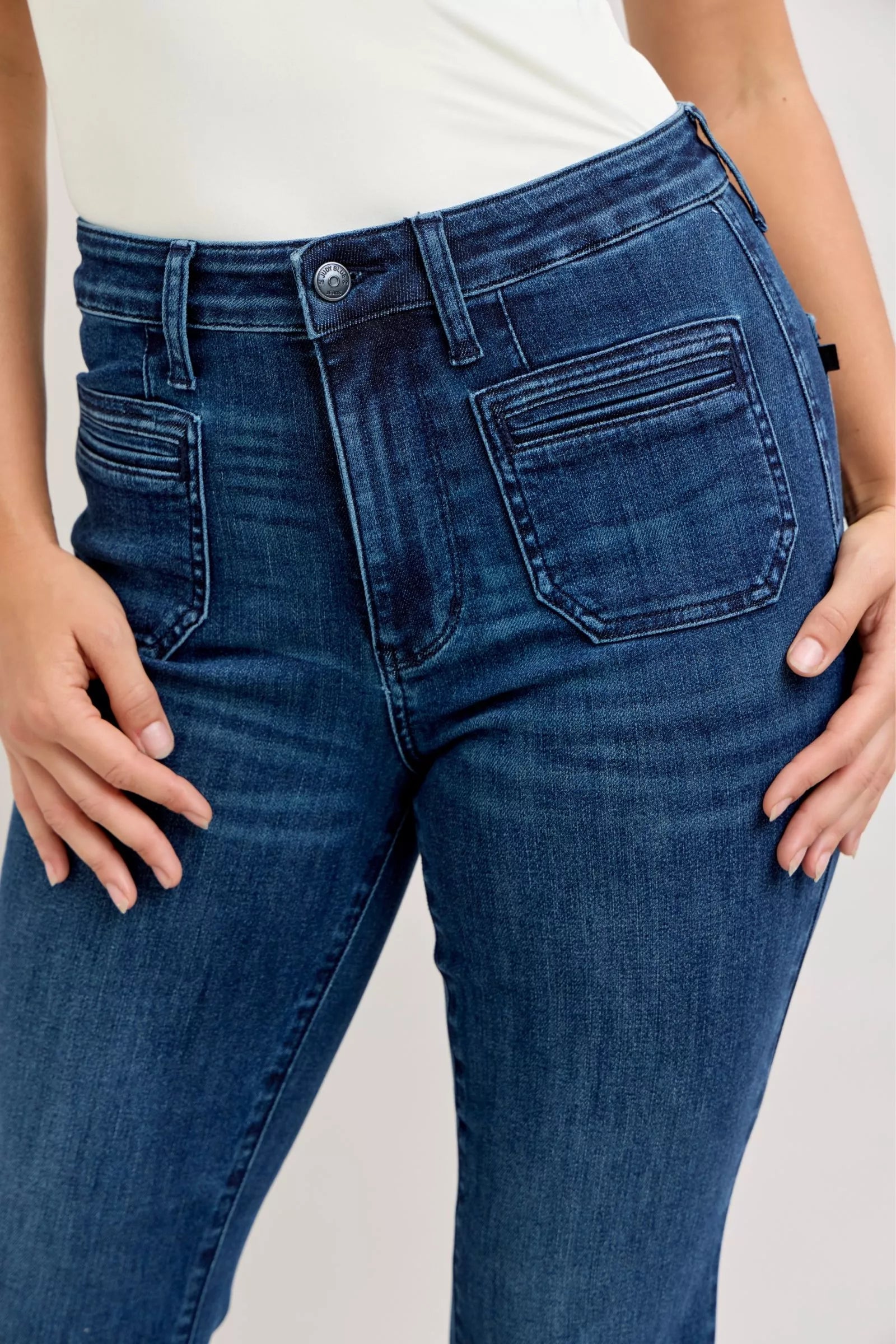 Judy Blue high-waisted flare jeans in dark blue denim, front view