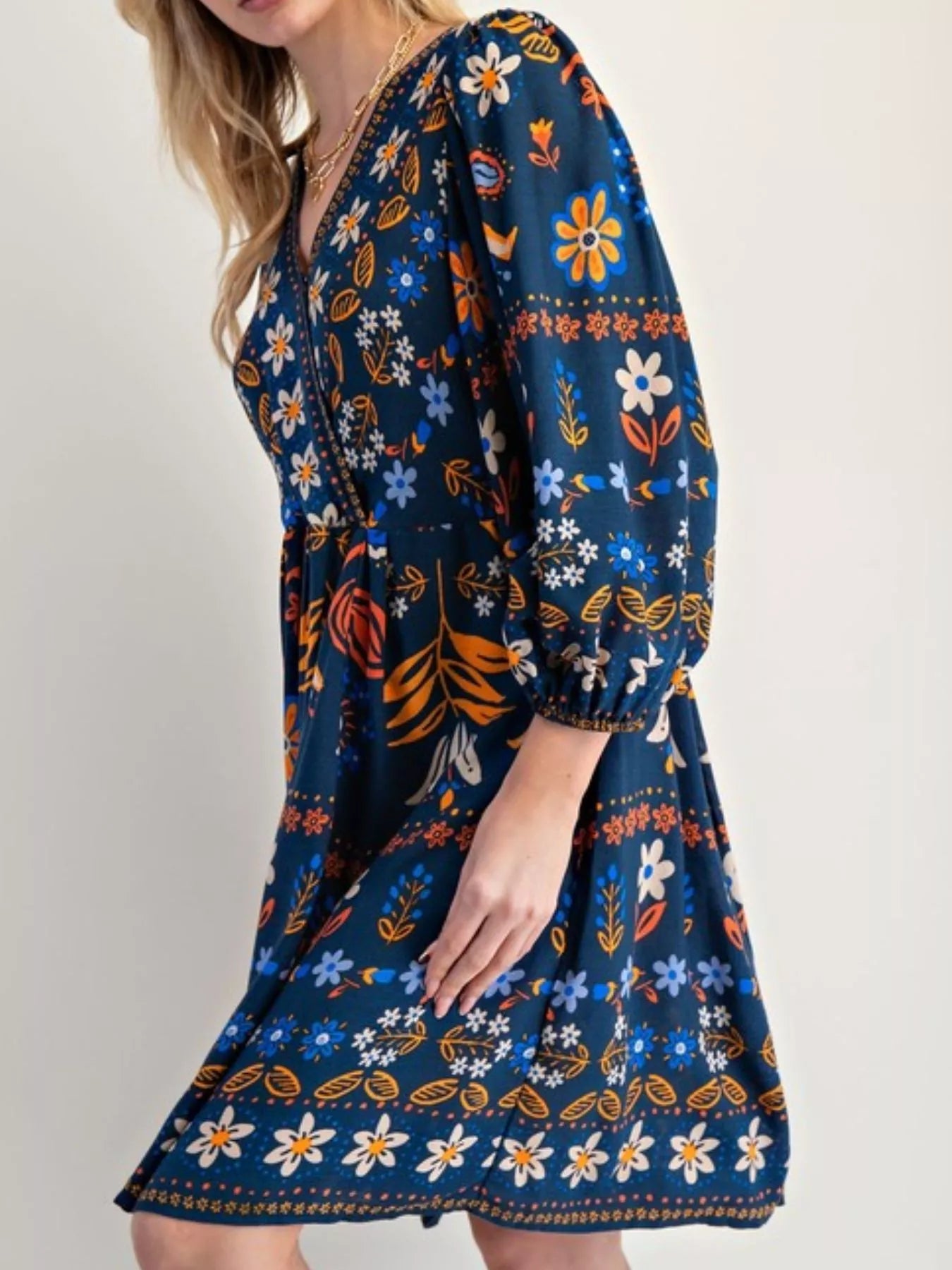 Bohemian navy blue floral print long sleeve mini dress with vibrant flowers