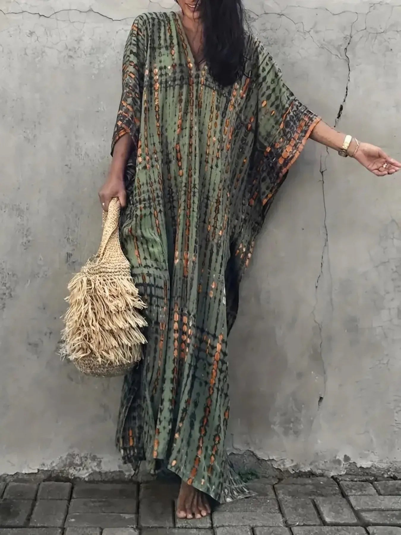Flowing olive-green tie-dye V-neck maxi dress with flowy sleeves and geometric pattern