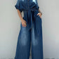 Daverri Fashions button-front wide-leg denim jumpsuit with collar and tied waistband
