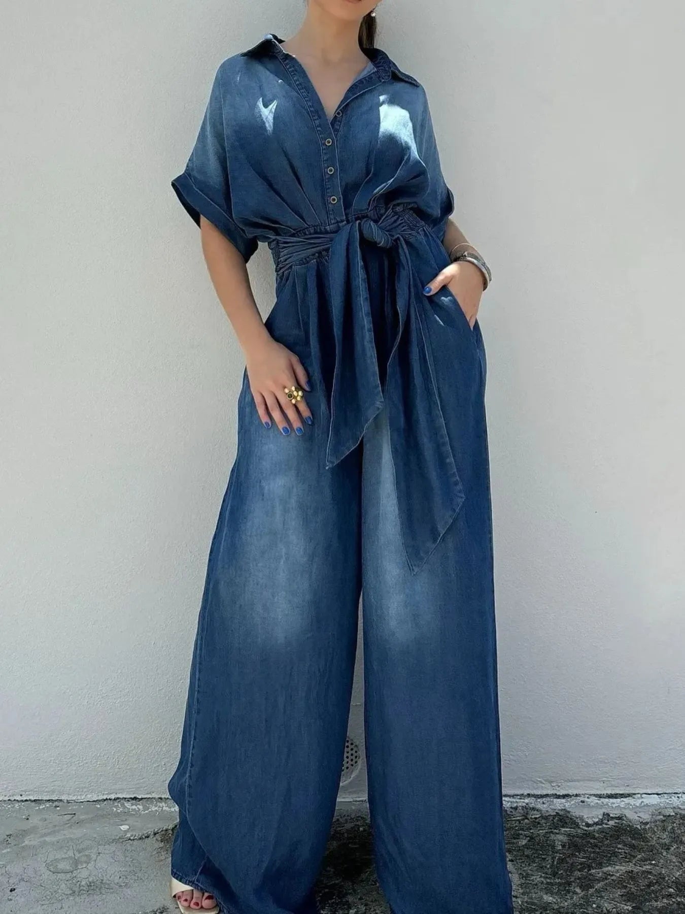 Daverri Fashions button-front wide-leg denim jumpsuit with collar and tied waistband