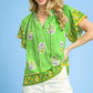 Vibrant green Umgee Boho Bloom Border Top with floral skull motifs