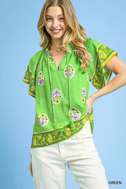 Vibrant green Umgee Boho Bloom Border Top with floral skull motifs