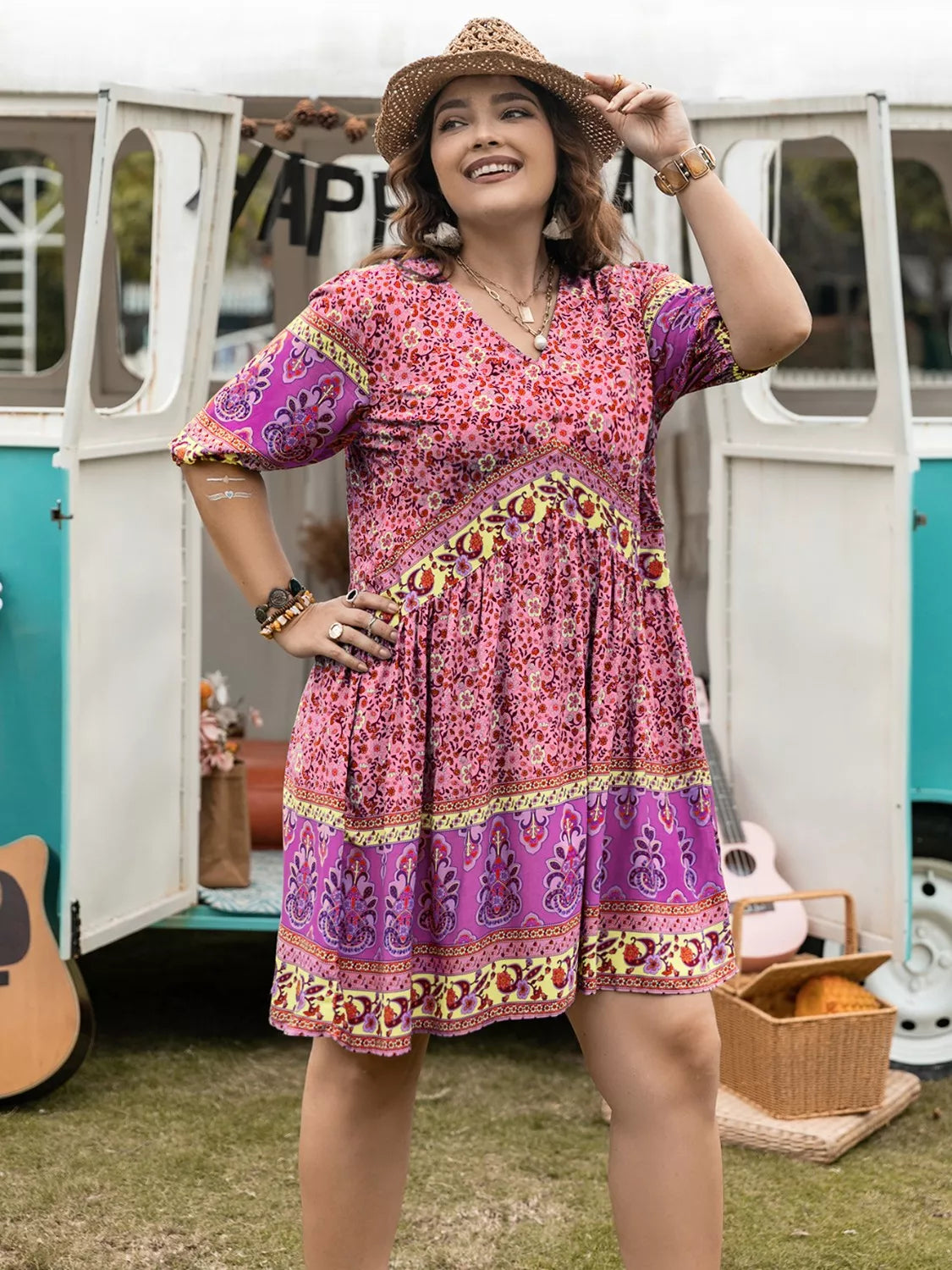 Vibrant pink purple floral plus-size V-neck mini dress with gold trim