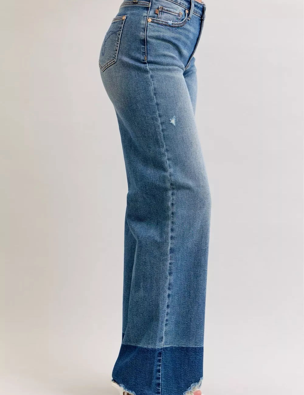 Light blue Judy Blue raw hem high waist flare jeans with distressed hem and white stitching