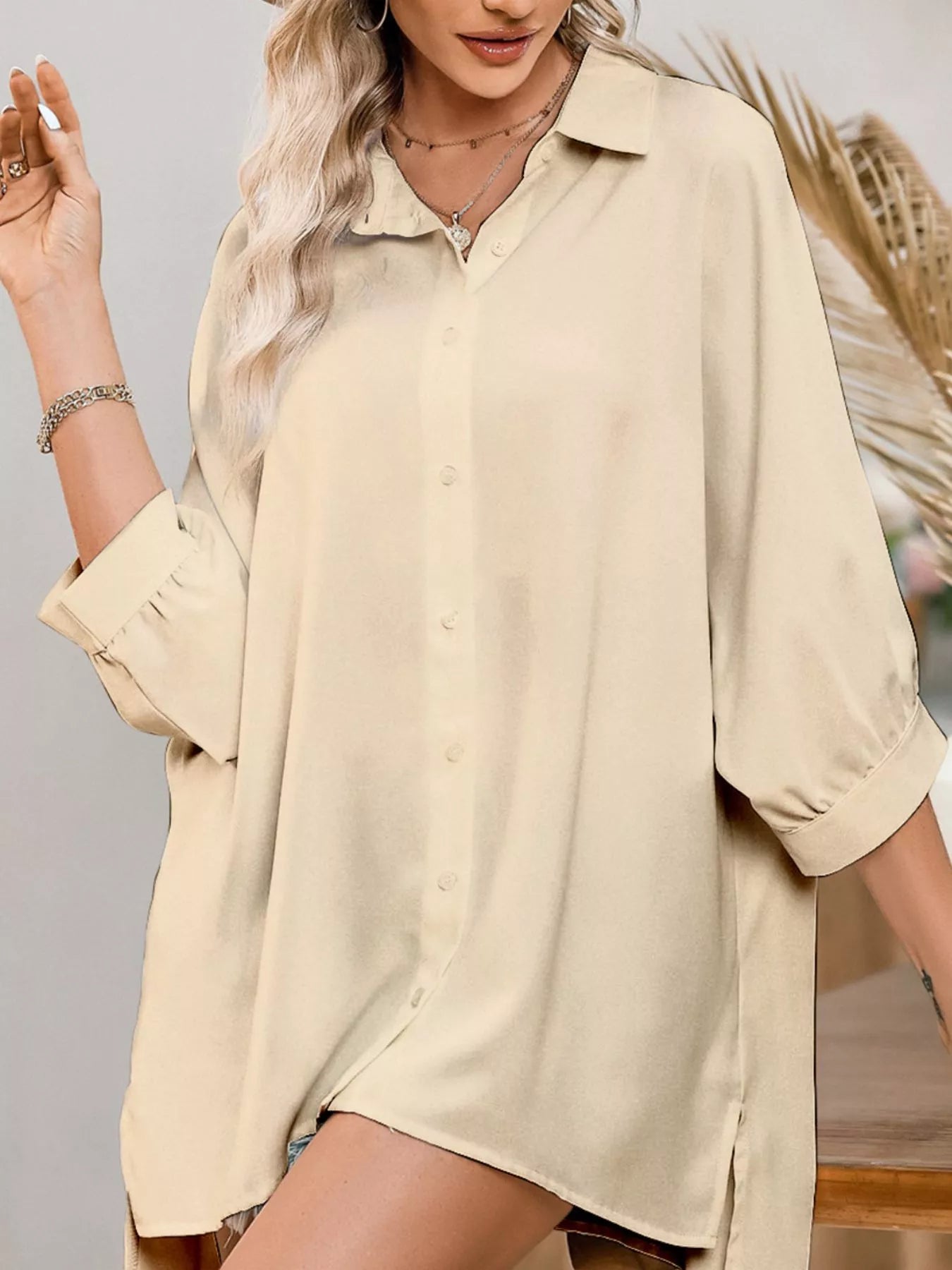 Beige womens oversized 3/4 sleeve button-down shirt with rolled cuffs