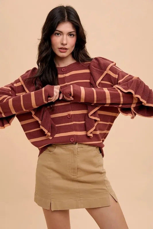 Maroon and tan striped knit cardigan with ruffled sleeves on khaki mini skirt