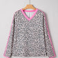 Women’s black white leopard print V-neck long sleeve top with pink trim