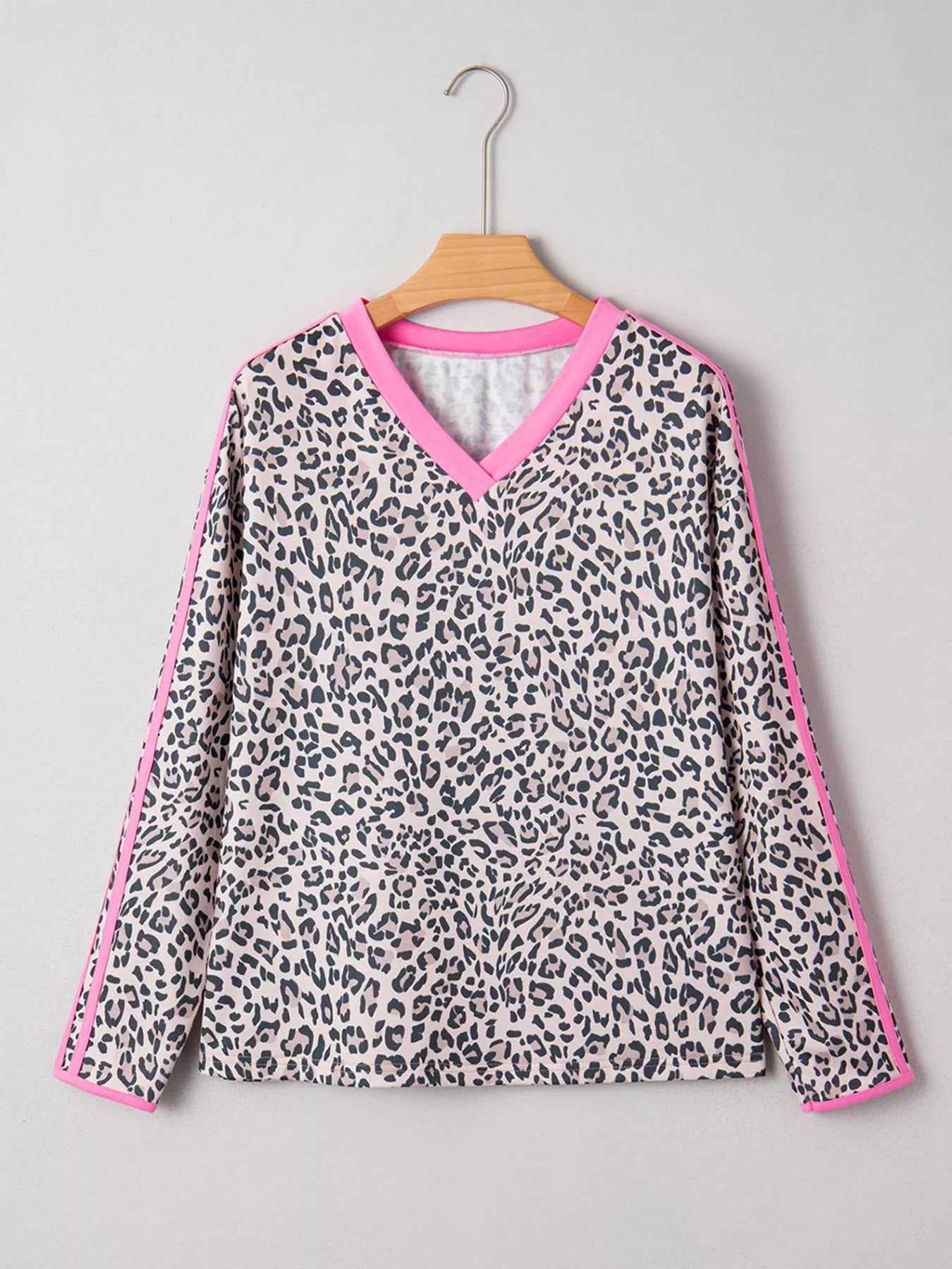 Women’s black white leopard print V-neck long sleeve top with pink trim