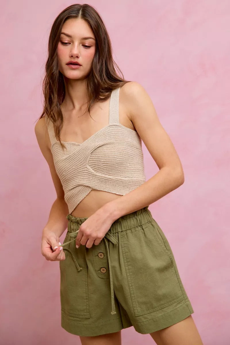 Beige crocheted crop top with thin straps, knot detail on SO ME twill shorts