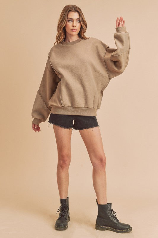 Aemi + Co Exposed Seam Round Neck Drop Shoulder Sweatshirt