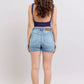 Judy Blue mid-rise light-wash denim shorts with 5-pocket design, leather patch