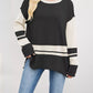 Black and cream colorblock long-sleeve side slit sweater with ribbed stripes