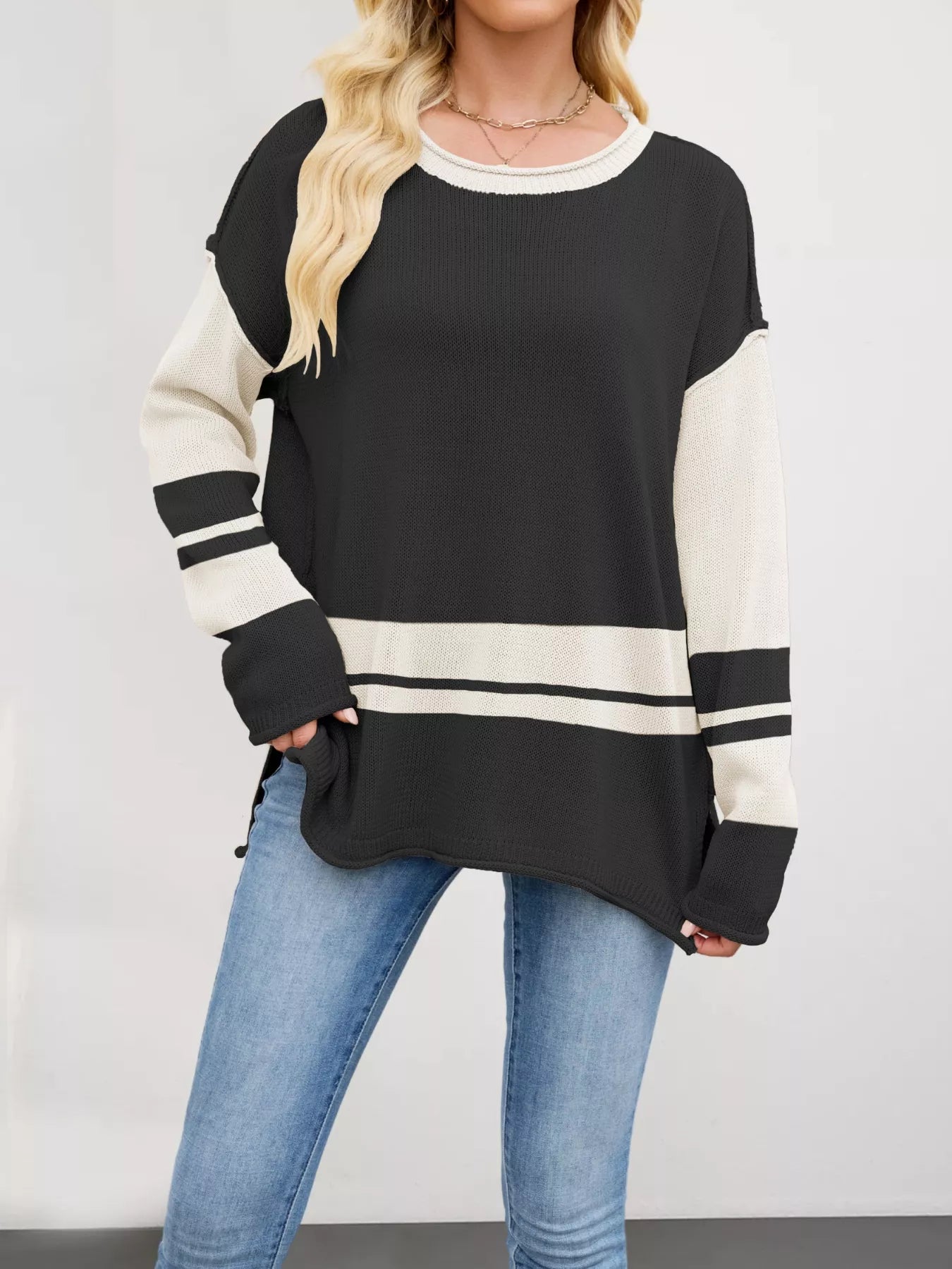 Black and cream colorblock long-sleeve side slit sweater with ribbed stripes