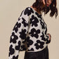 Cozy SO ME loose fit flower lightweight sweater top in off-white knit with black floral patterns