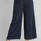 Navy blue wide-leg Umgee linen pants with dotted pattern and elastic waist