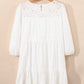 White 3/4 sleeve tiered mini dress with eyelet lace neckline and sleeves