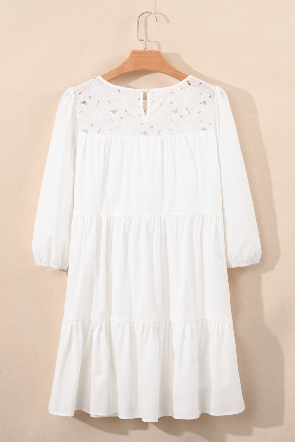 White 3/4 sleeve tiered mini dress with eyelet lace neckline and sleeves