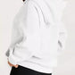 White oversized kangaroo pocket hoodie with relaxed fit and ribbed cuffs