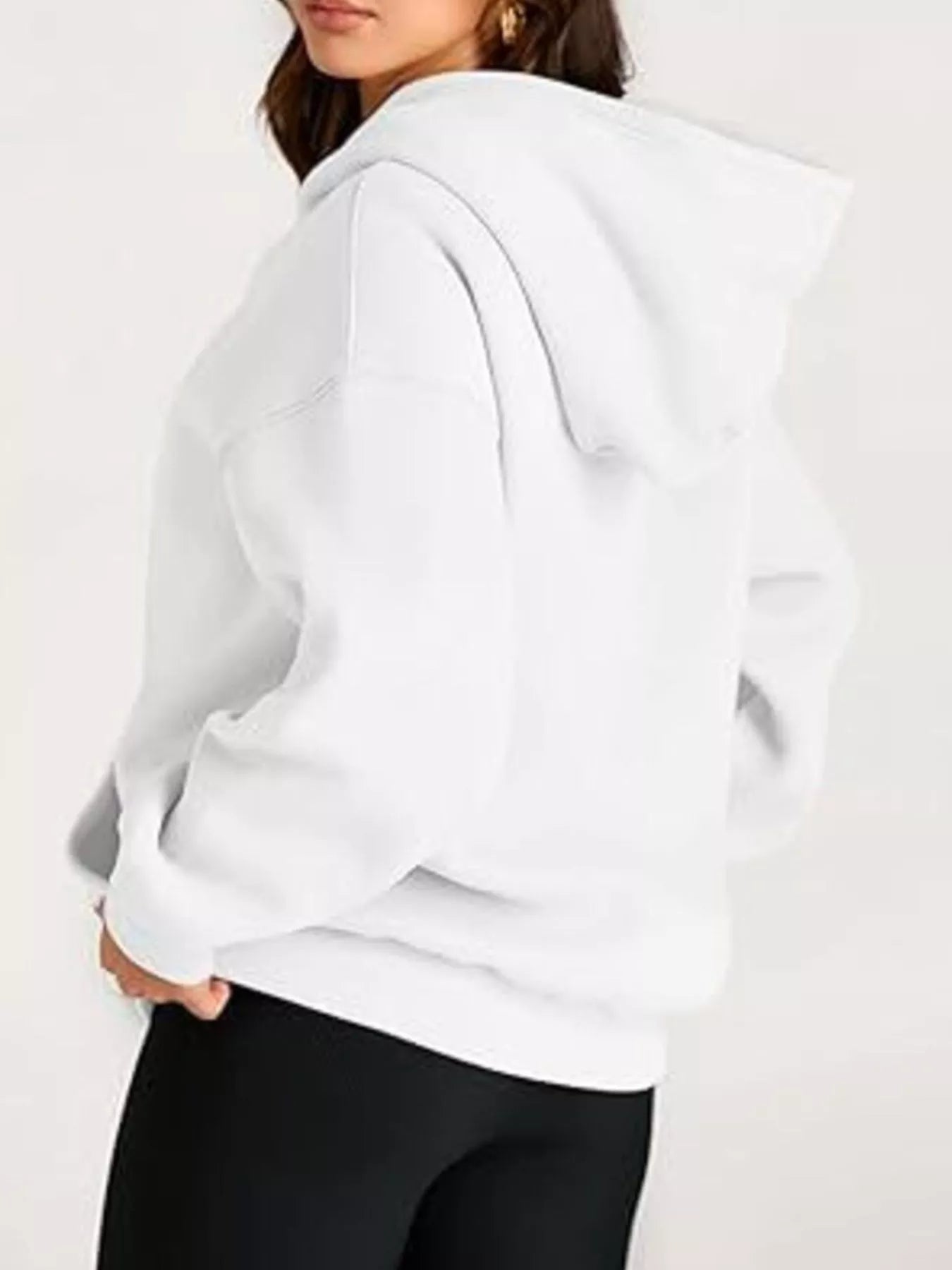 White oversized kangaroo pocket hoodie with relaxed fit and ribbed cuffs