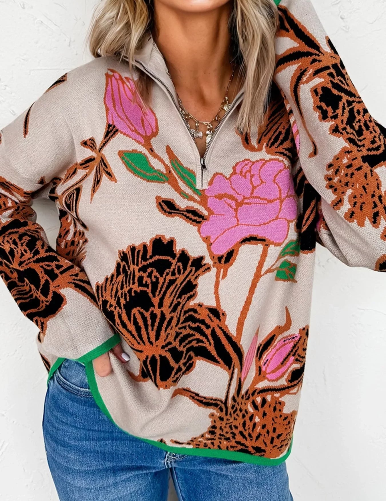 Floral print quarter zip knit sweater with green accents on beige base