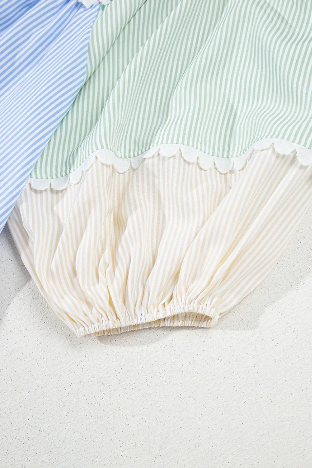 Pastel-striped baby bloomers with scalloped edges for mini dress
