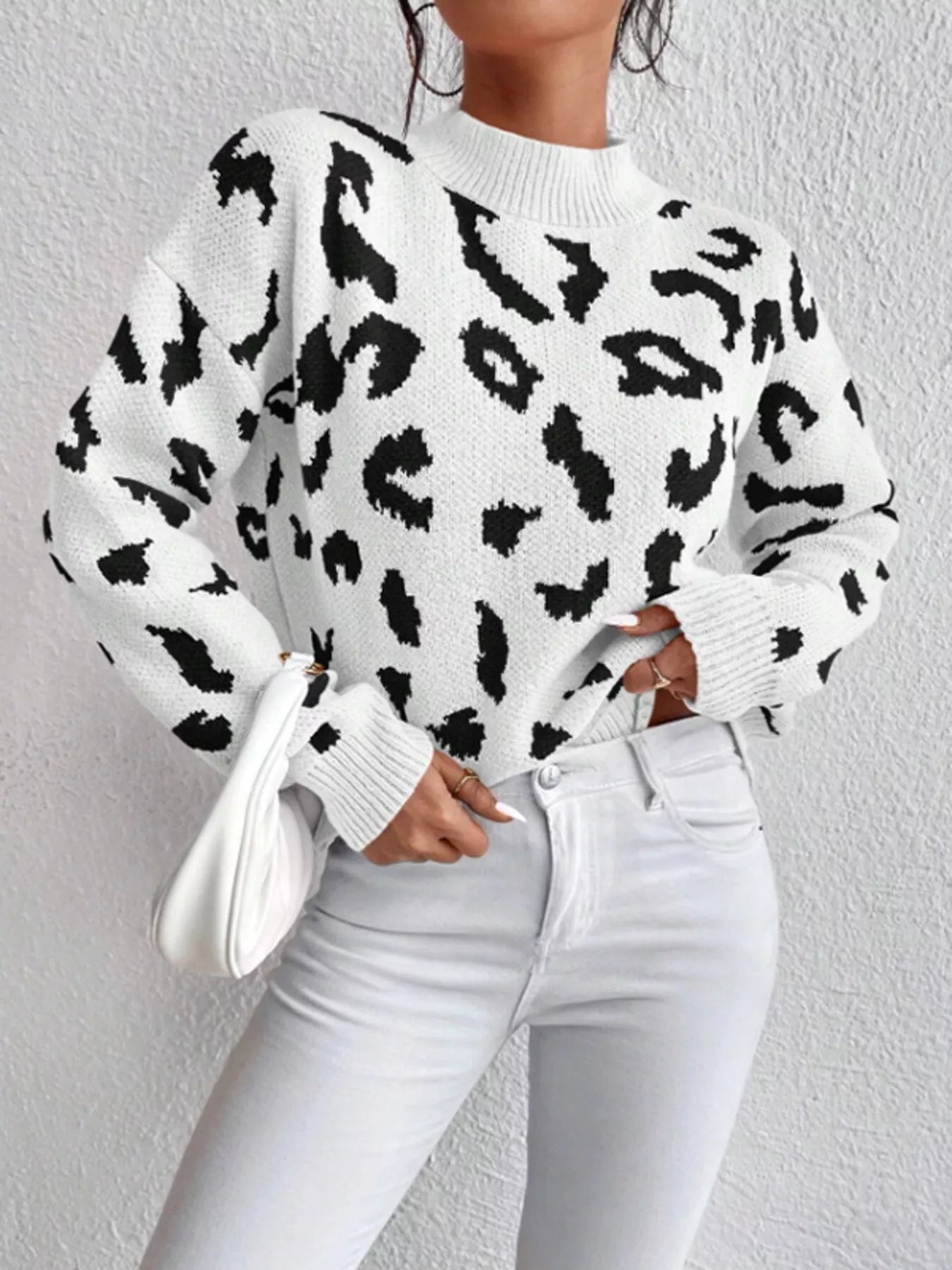 Leopard mock neck sweater with long sleeves and ribbed cuffs on white background