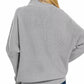 Grey textured Zenana viscose dolman sleeve mock neck sweater with jeans