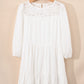 White 3/4 sleeve tiered mini dress with eyelet lace neckline ruffles