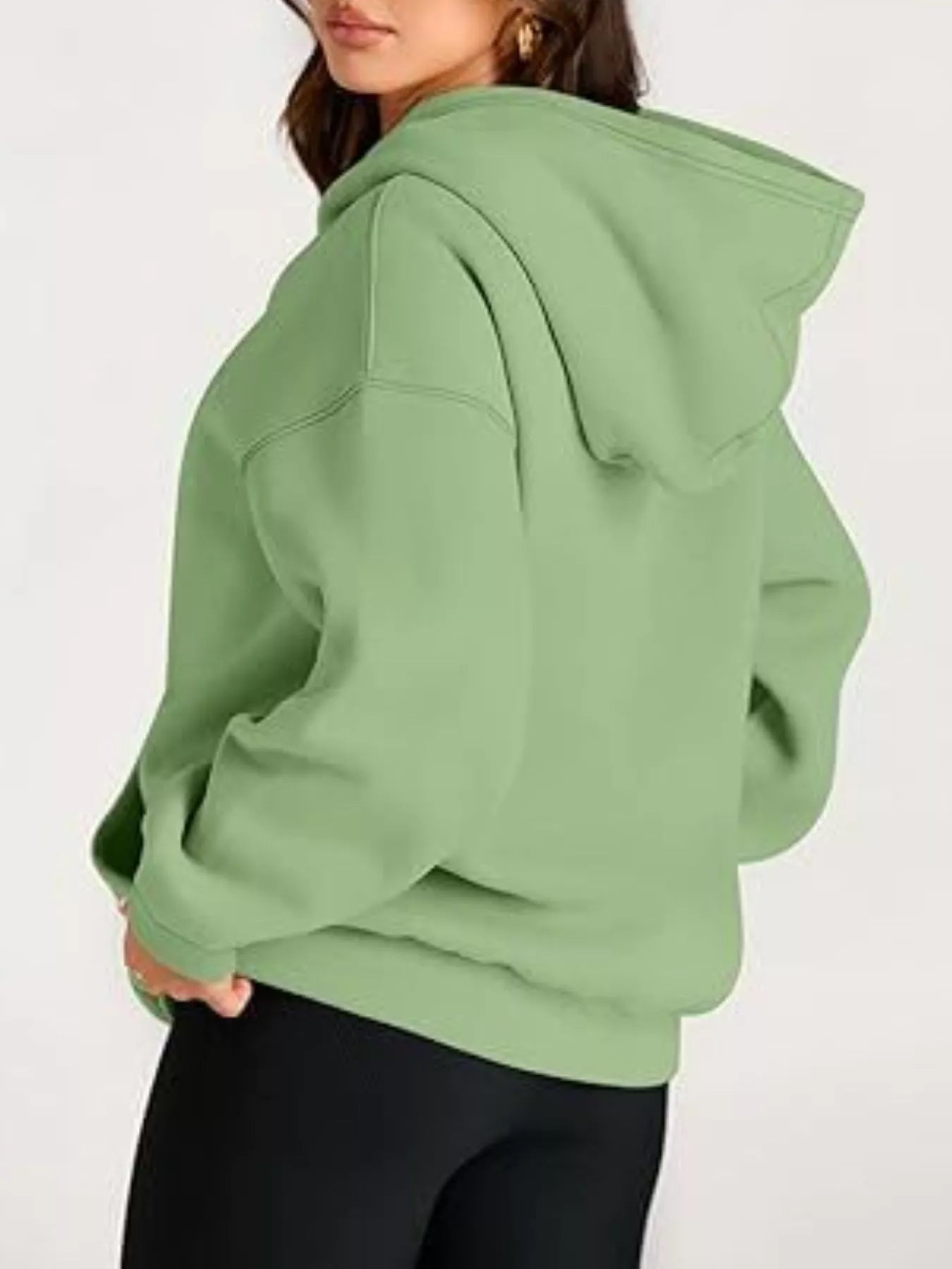 Sage green oversized kangaroo pocket long sleeve hoodie with relaxed fit and ribbed cuffs