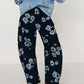 Printed wide leg jeans in dark denim with light blue floral pattern