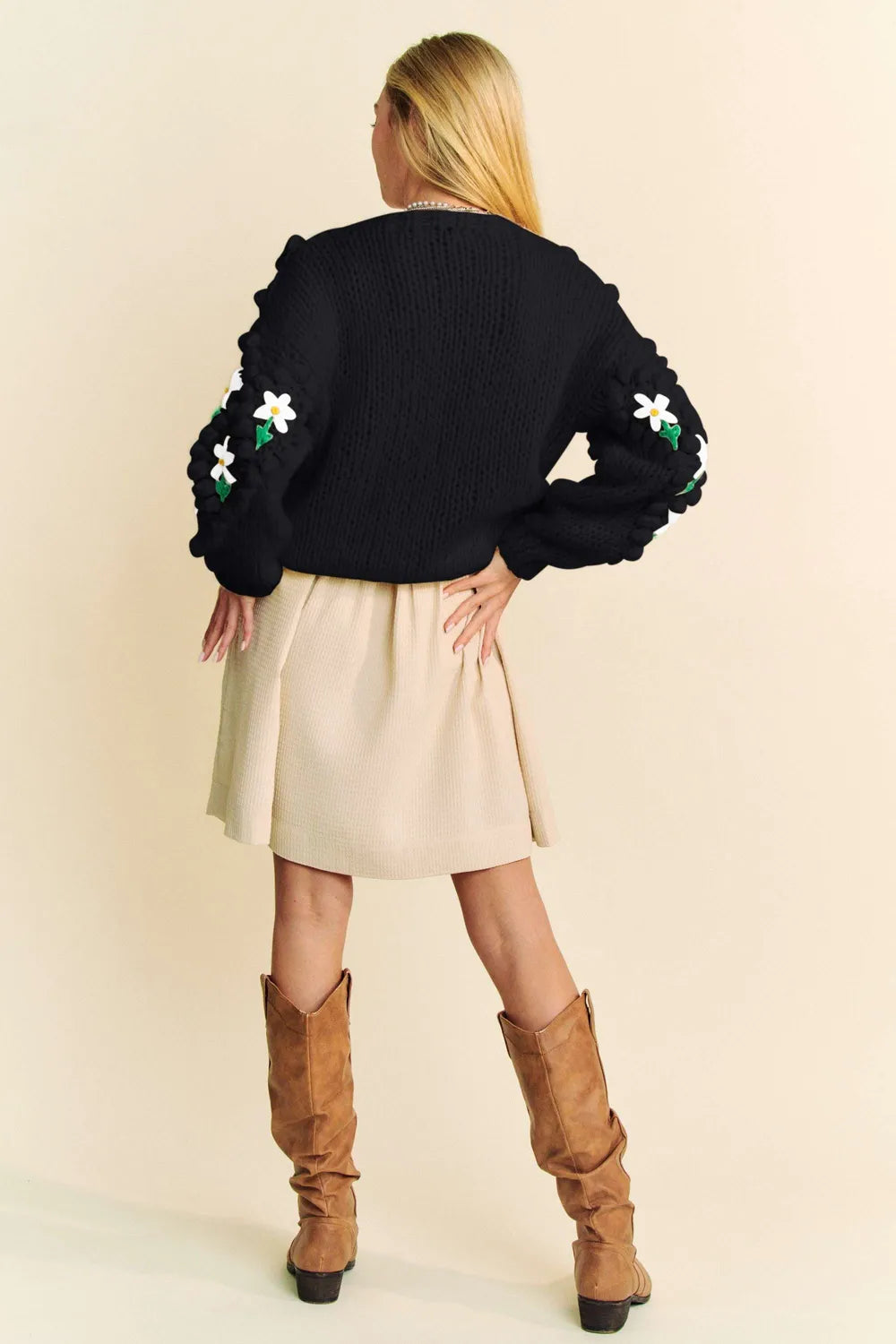 Black knit Davi & Dani cardigan with ruffled sleeves and floral embroidery