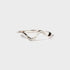 Silver ring with a wavy design on a white background