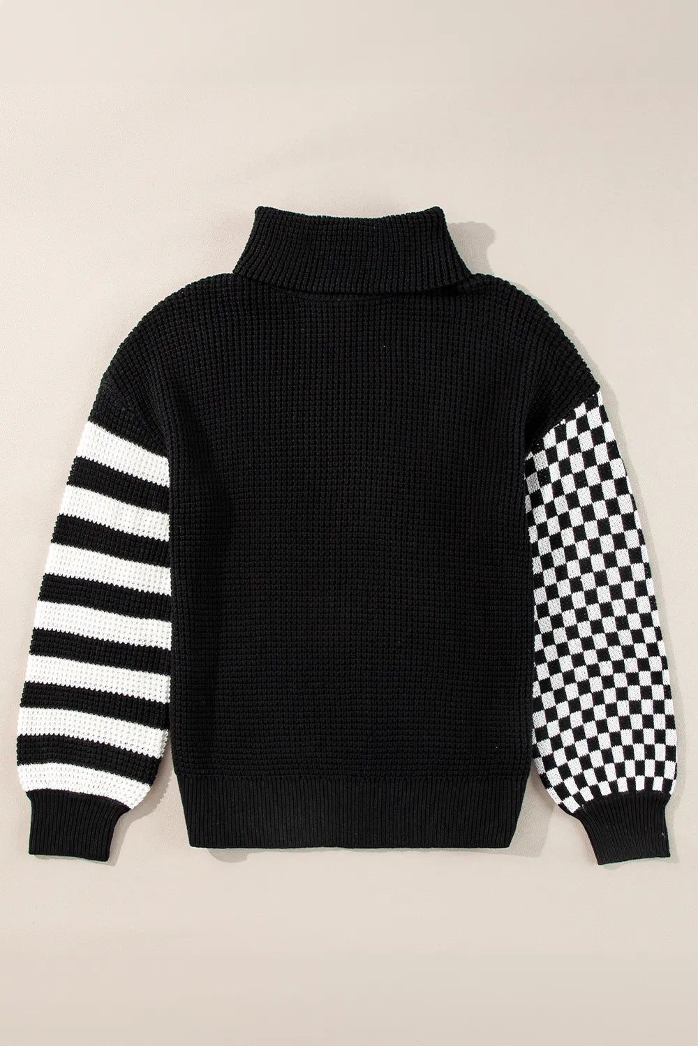 Striped and checkered turtleneck dropped shoulder sweater in black